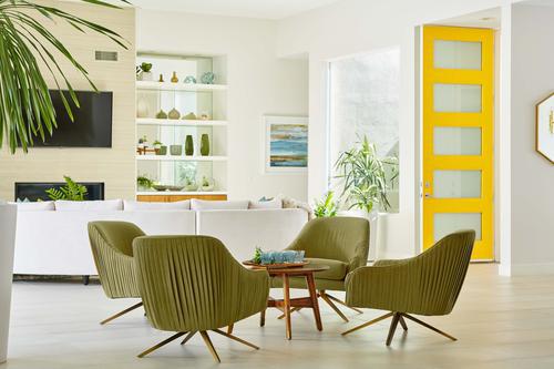 green chairs and coffee table at Residence Two at Skye