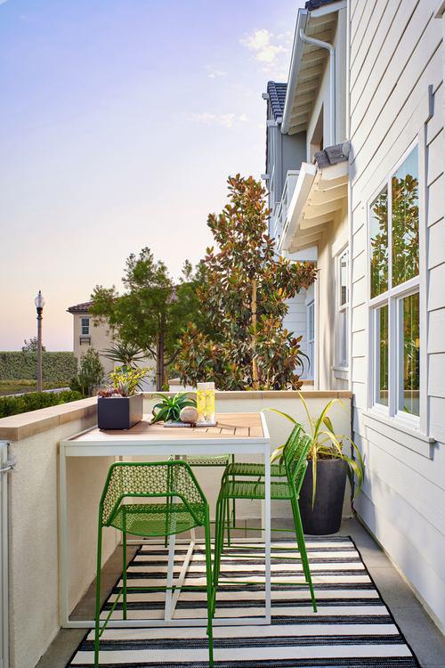 patio with green chairs at Plan 3 at Bayberry