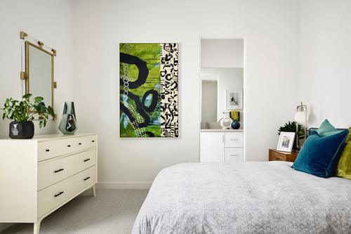 guest bedroom at Residence One at Flair by Woodbridge Pacific Group