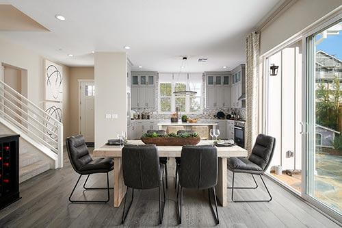 kitchen and dining room in the Plan Four at Dover at Compass Bay by Trumark Homes