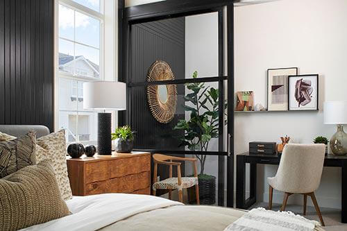 black tongue and groove paneling in bedroom by Chameleon Design