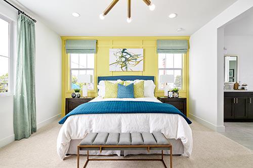 yellow rectangular paneling in bedroom by Chameleon Design