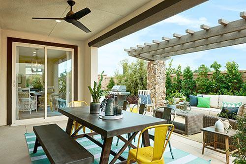 dining set, sofa, and pergola on patio by Chameleon Design