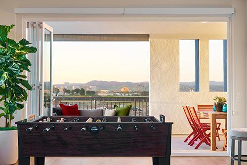 pool table and deck/outdoor patio area by Chameleon Design