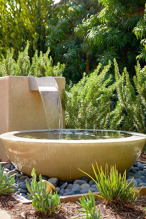 water feature in backyard by Chameleon Design