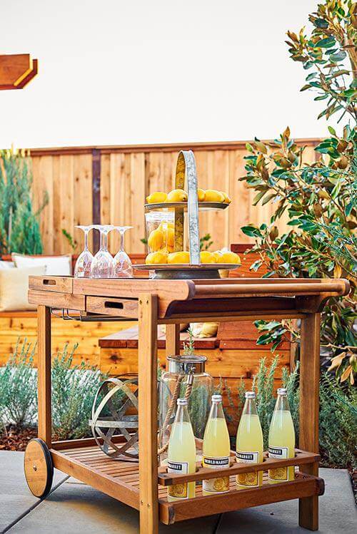 teak bar cart on patio by Chameleon Design