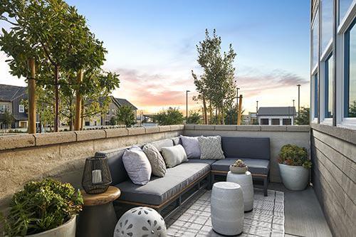 outdoor sectional sofa and garden stools on patio by Chameleon Design