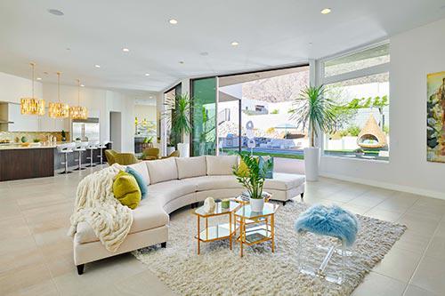 curved white sofa in living room by Chameleon Design