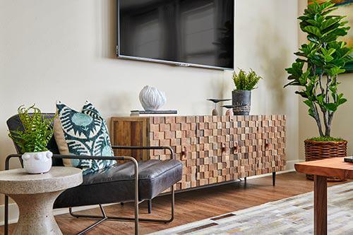 gray leather and metal armchair in living room by Chameleon Design