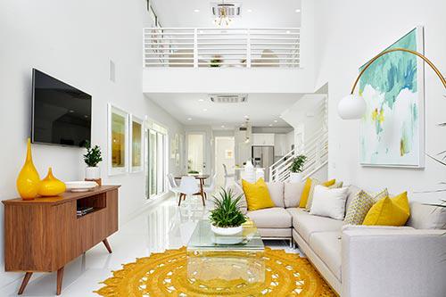 round yellow jute rug in living room by Chameleon Design