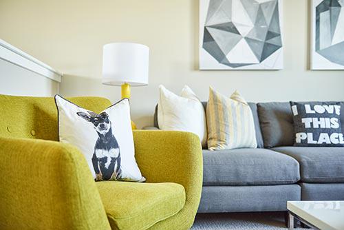 chartreuse accent chair in living room by Chameleon Design