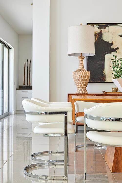 curved dining chairs in dining room by Chameleon Design