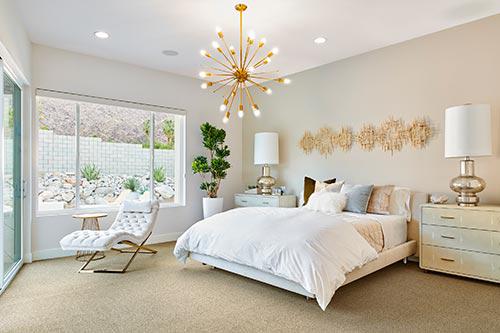 white reclining accent chair in bedroom by Chameleon Design