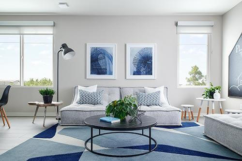 blue abstract rug in living room by Chameleon Design