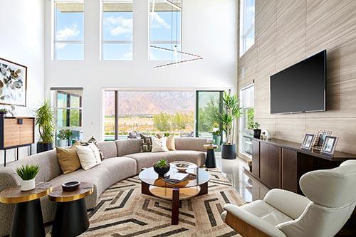 brown, cream, and black abstract rug in living room by Chameleon Design