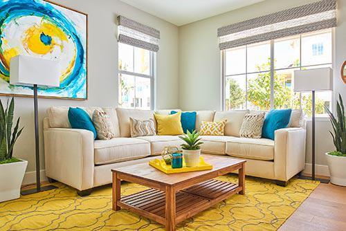 yellow and gray patterned rug in living room by Chameleon Design