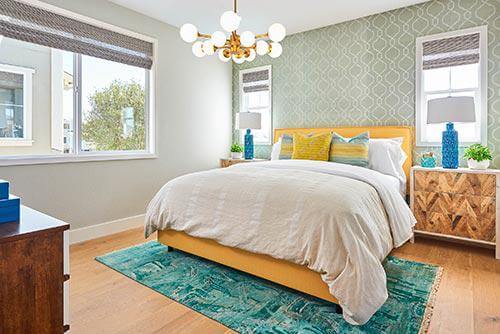teal abstract rug in bedroom by Chameleon Design