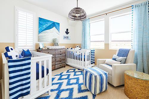 blue and white rug in nursery by Chameleon Design