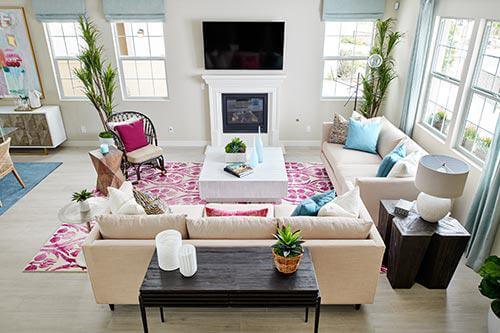 neutral living room with fuschia accents
