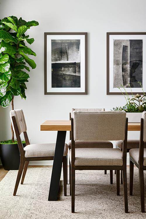 white dining room with abstract art
