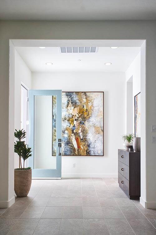 neutral entryway with wall art