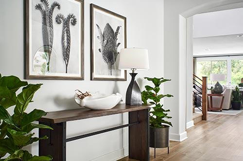 white entryway with botanical accents