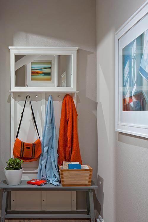 neutral entryway with orange accents