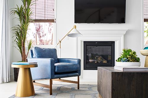 living room with while walls and blue and gold accents