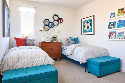 kids bedroom with white walls and teal accents
