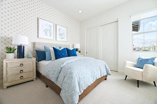 bedroom with blue bedding and accents PGA West