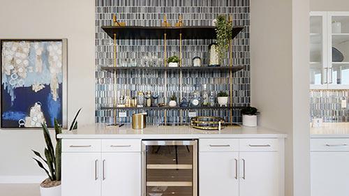 bar with white cabinets and blue and gray tile backsplash Rancho Mirage