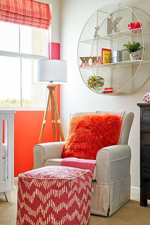 upholstered chair and ottoman with orange accents Center House