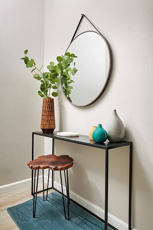 compact entryway with small console table and mirror Indigo