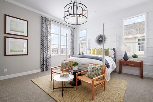 white primary bedroom with wood and rattan features at Plan 1 Dover at Compass Bay in Newark, California
