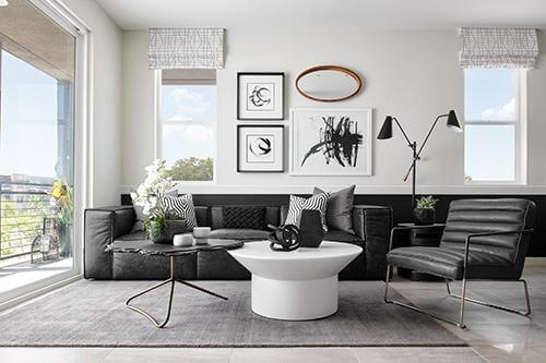 living room with black sofa and accents Verge