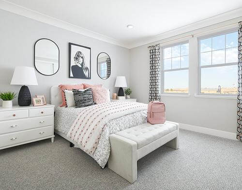 kid’s room with pastel gray painted walls and millennial pink bed pillows Splash at One Lake