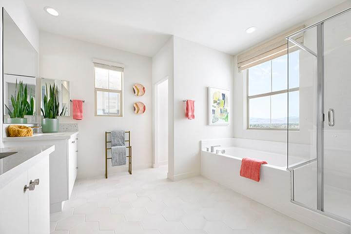 clean white bathroom with tub and shower