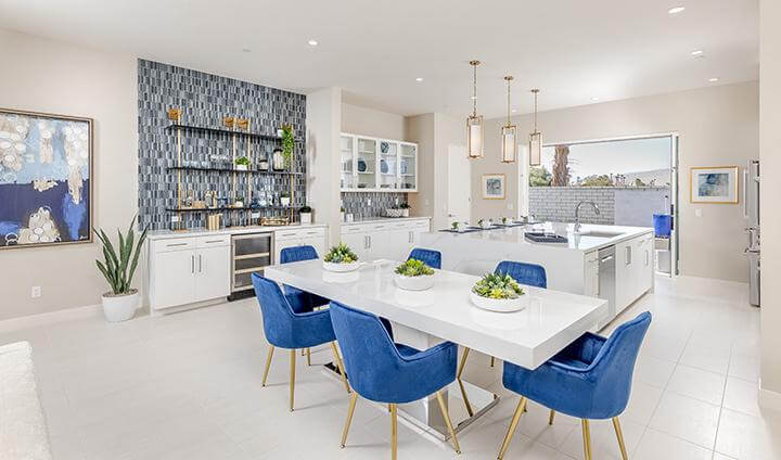 contemporary dining area, kitchen, and bar with blue accents
