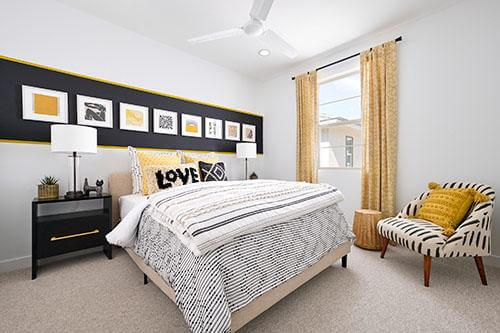 neutral bedroom with yellow accents