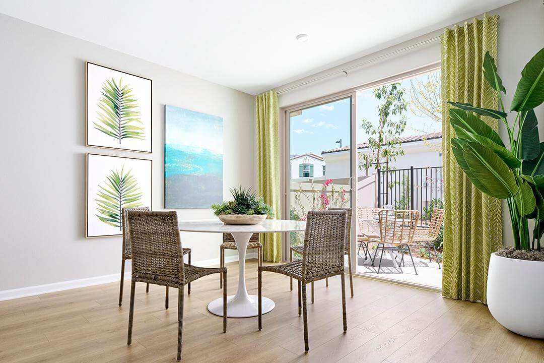 bright dining room with green curtains