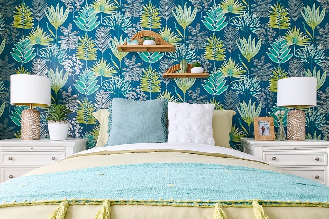 bedroom with tropical graphic wallpaper and natural elements