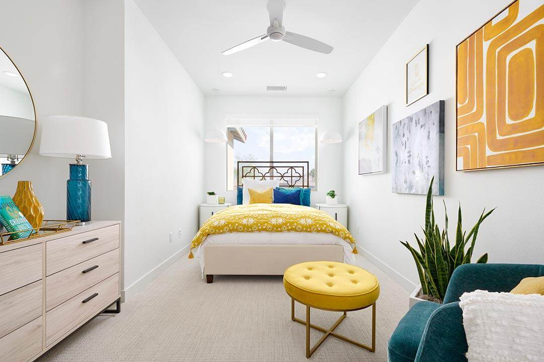 bright white bedroom with colorful accents