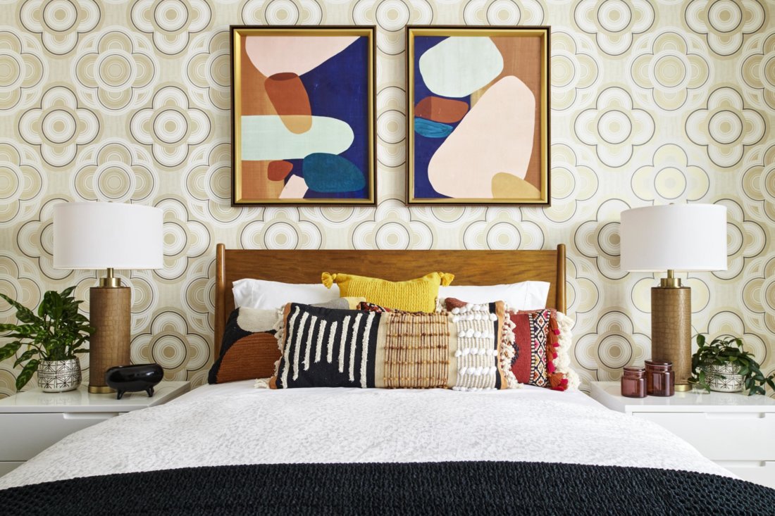 bedroom with beige wallpaper and modern art