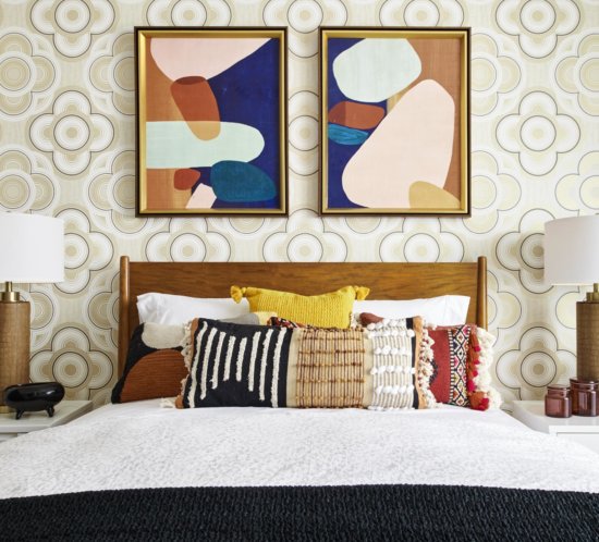 bedroom with beige wallpaper and modern art