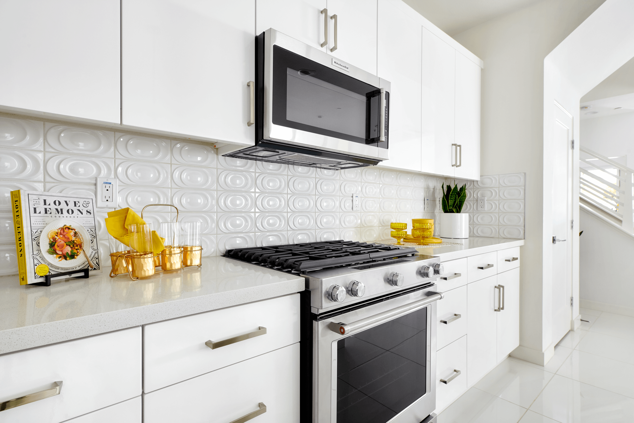 white kitchen with textured tile backsplash