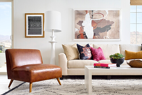 contemporary living room with leather chair and modern art