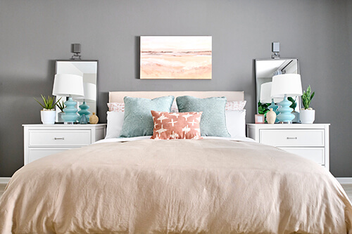 bedroom with gray wall and pastel decor