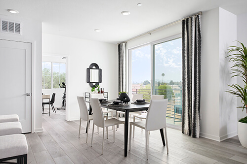 white and gray dining room with sliding doors