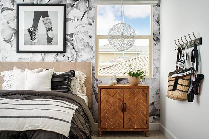 bedroom with large floral wallpaper in black and white