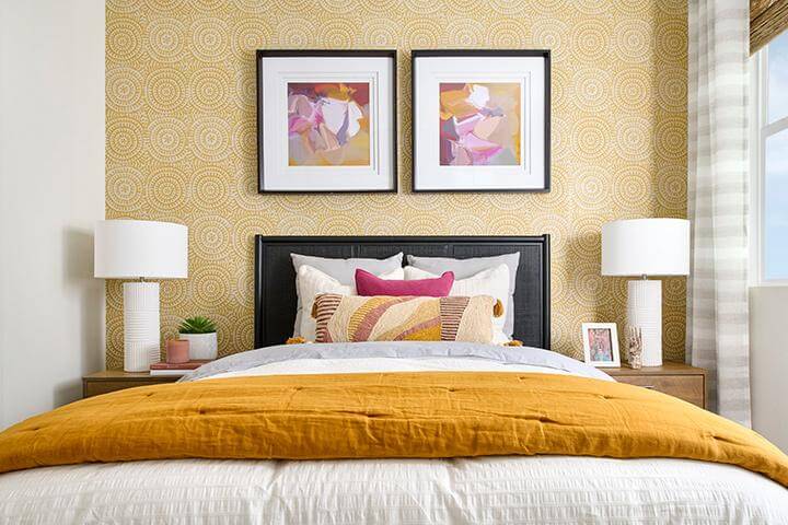 orange and pink bedroom with modern floral pictures